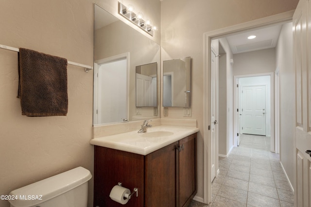 bathroom featuring tile patterned floors, vanity, and toilet