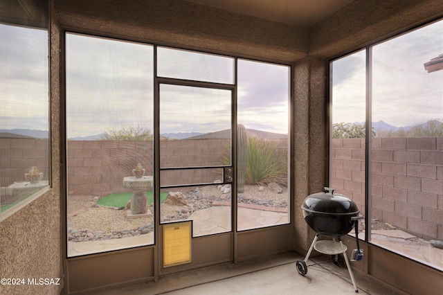 sunroom with a mountain view