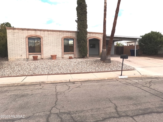 view of front of home featuring a carport