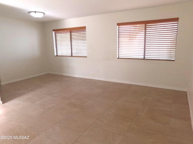 unfurnished room featuring a wealth of natural light