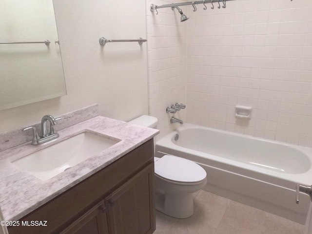 full bathroom with tile patterned floors, vanity, toilet, and tiled shower / bath