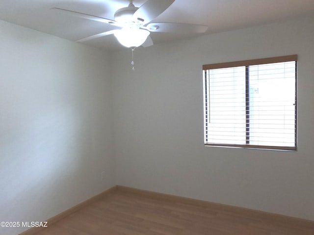 unfurnished room with wood-type flooring and ceiling fan