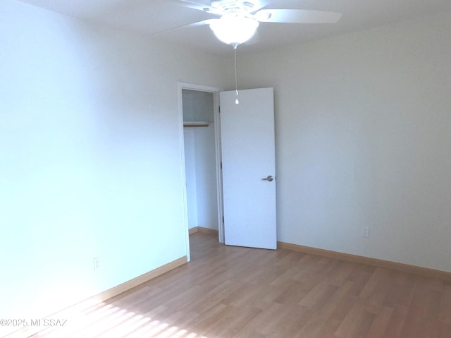 unfurnished room featuring ceiling fan and hardwood / wood-style flooring