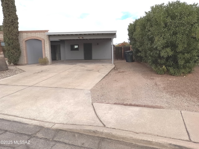 exterior space with a carport