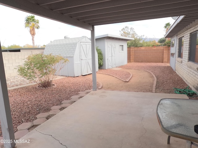 view of patio with a storage shed