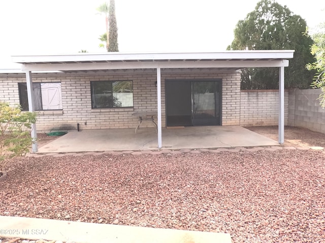 rear view of property featuring a patio