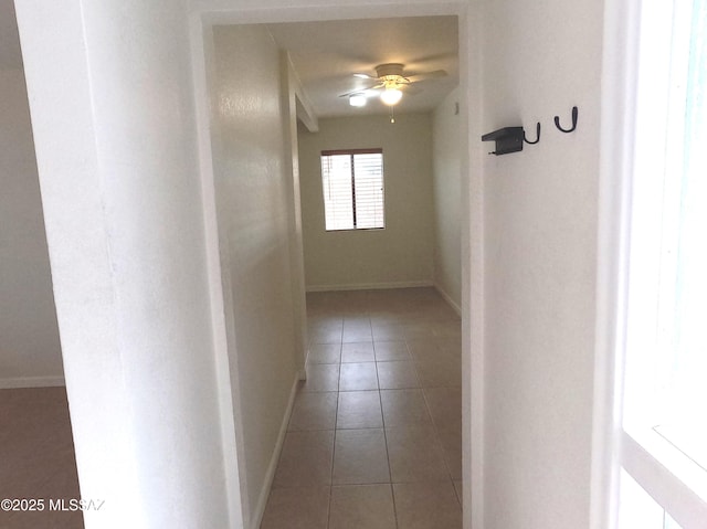 corridor featuring light tile patterned flooring