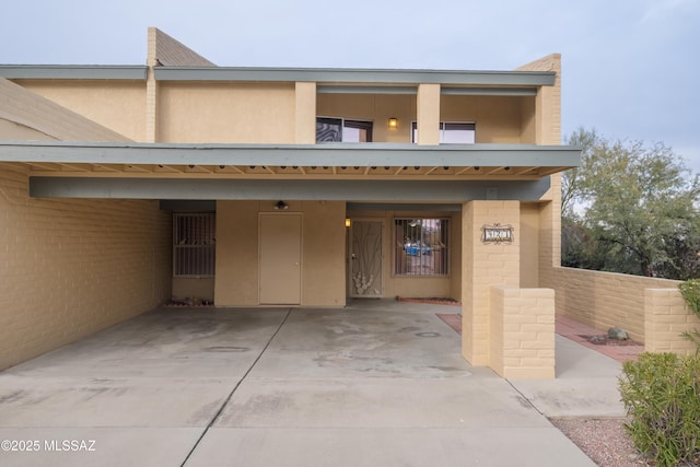 exterior space with a carport