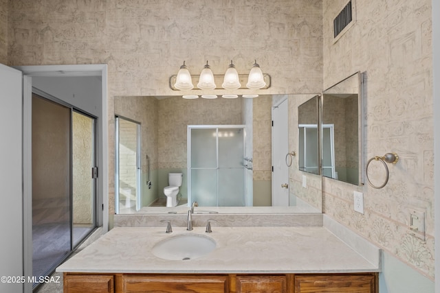 bathroom with vanity and toilet