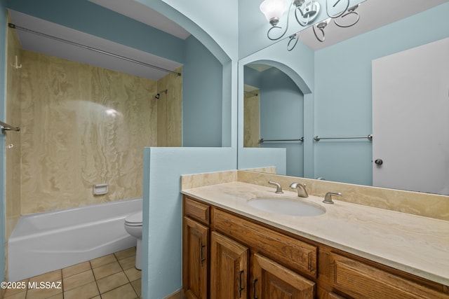 full bathroom featuring vanity, an inviting chandelier, tile patterned flooring, toilet, and tub / shower combination