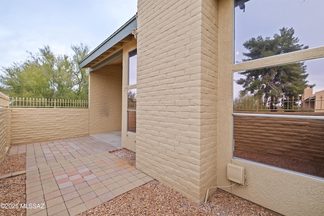 view of property exterior with a patio