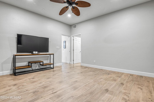 living room with ceiling fan and light hardwood / wood-style floors