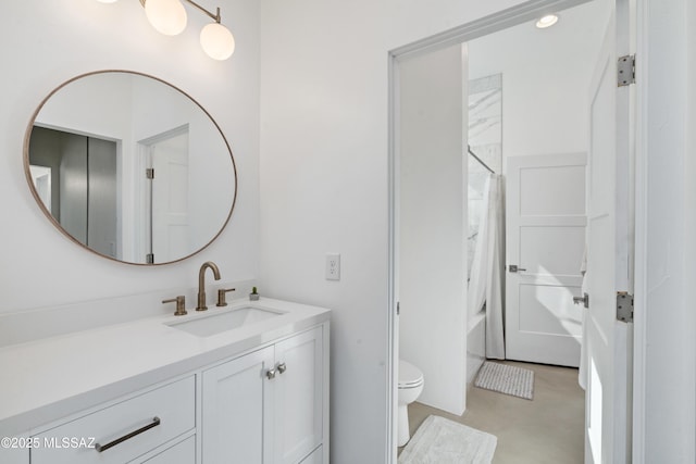 bathroom featuring toilet, vanity, and shower / bath combination with curtain
