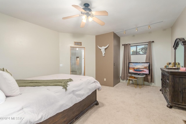 bedroom featuring light colored carpet and ceiling fan