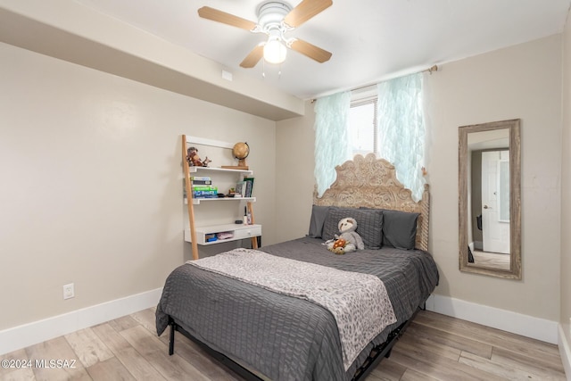 bedroom featuring ceiling fan and light wood-type flooring