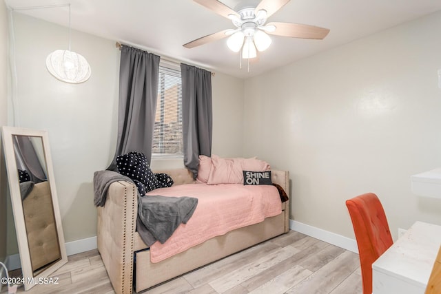 bedroom with ceiling fan and light wood-type flooring