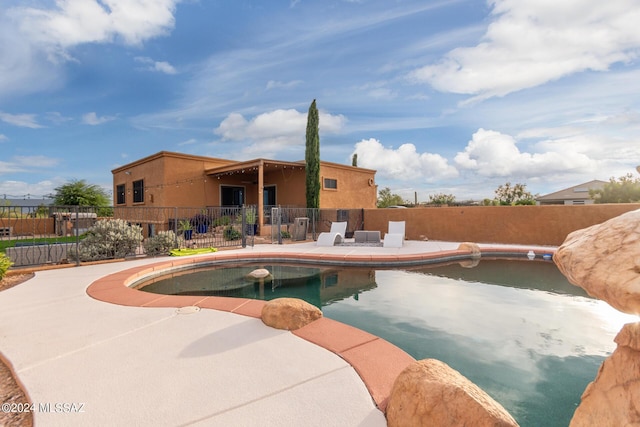 view of swimming pool with a patio area