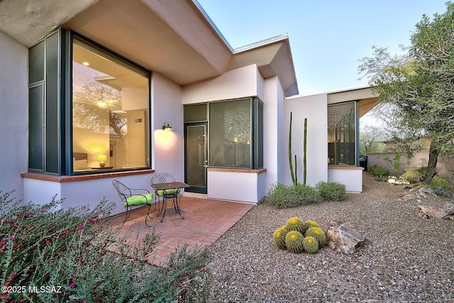 view of side of property with a patio