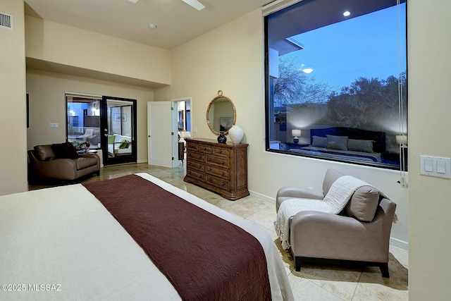 bedroom featuring ceiling fan and light tile patterned floors