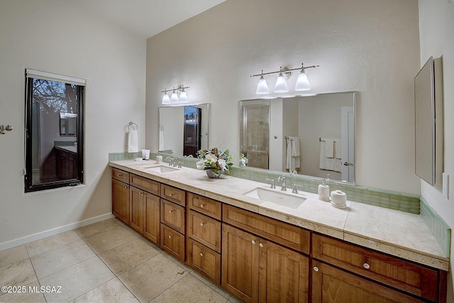 bathroom with vanity, tile patterned floors, and walk in shower