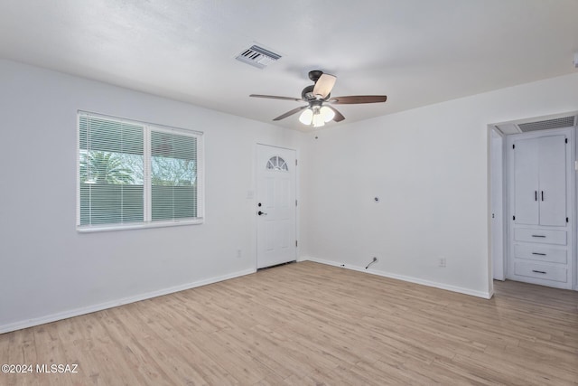 unfurnished room featuring ceiling fan and light hardwood / wood-style flooring