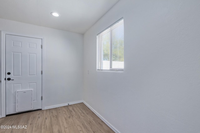 empty room with light hardwood / wood-style floors