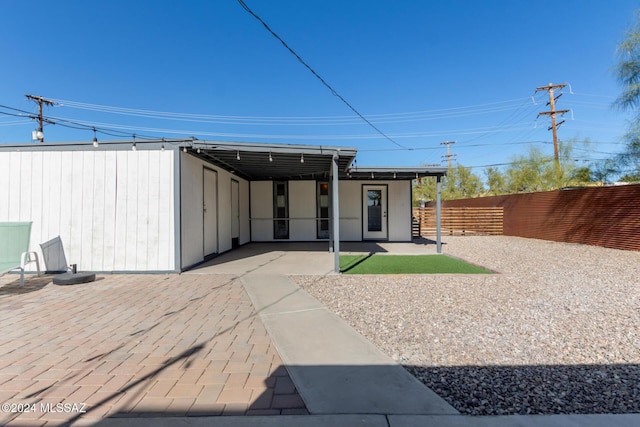 rear view of house with a patio