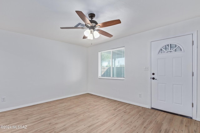 entrance foyer with ceiling fan and light hardwood / wood-style flooring