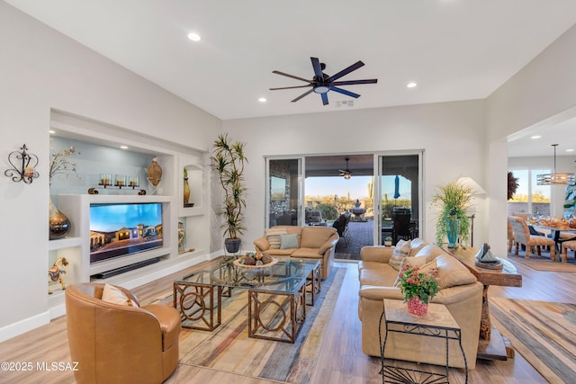 2333 E Copper Valley Way, Green Valley, AZ 85614 - living area featuring wood finished floors, a ceiling fan, visible vents, and recessed lighting