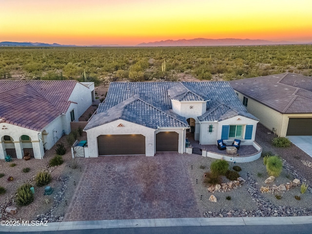 2333 E Copper Valley Way, Green Valley, AZ 85614 - view of front of property featuring stucco siding, decorative driveway, and an attached garage