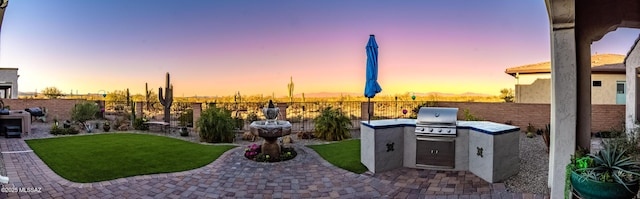2333 E Copper Valley Way, Green Valley, AZ 85614 - view of patio with grilling area, an outdoor kitchen, and a fenced backyard