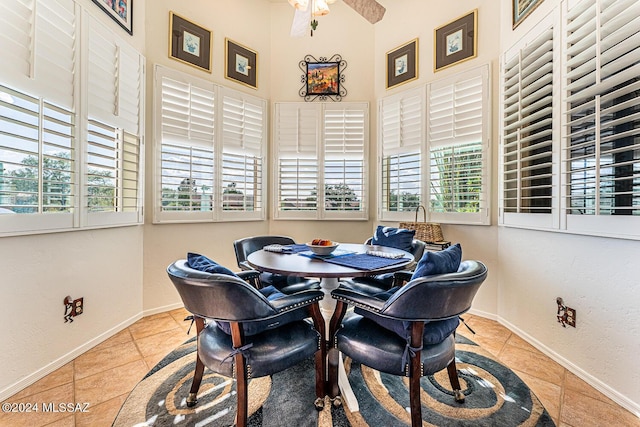 dining area with a wealth of natural light and light tile patterned flooring