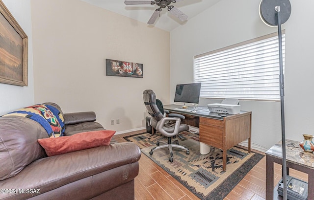 office space with light hardwood / wood-style floors and ceiling fan