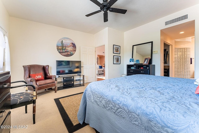 bedroom with ceiling fan and light carpet