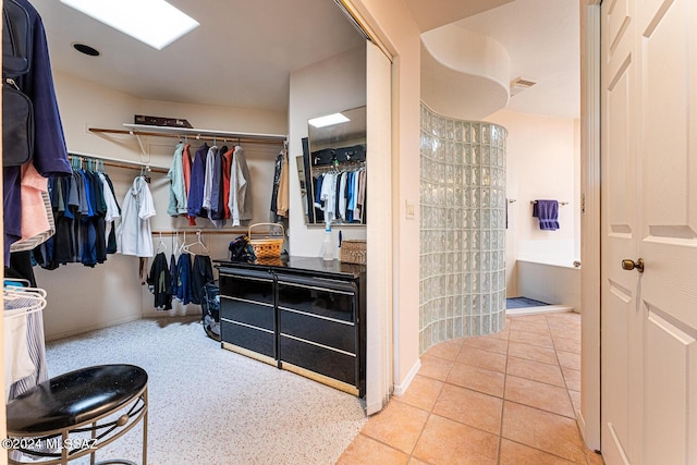 spacious closet featuring light tile patterned floors