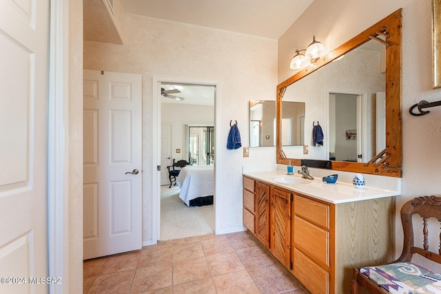 bathroom featuring tile patterned flooring and vanity