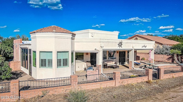 rear view of house featuring a patio area