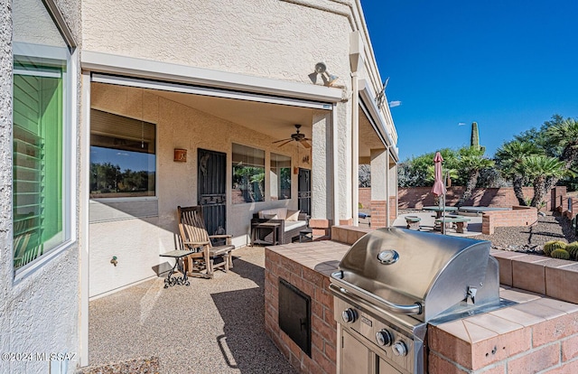 view of patio / terrace with ceiling fan and area for grilling