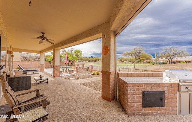 view of patio / terrace featuring ceiling fan, area for grilling, and grilling area