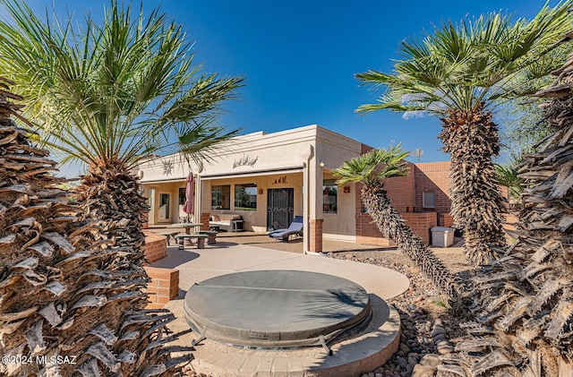 rear view of property with a patio area