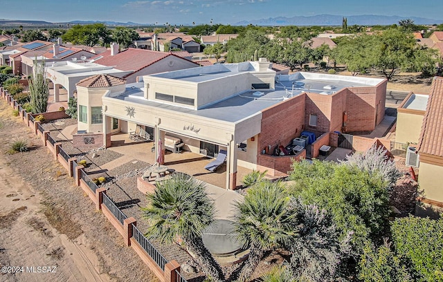 birds eye view of property featuring a mountain view