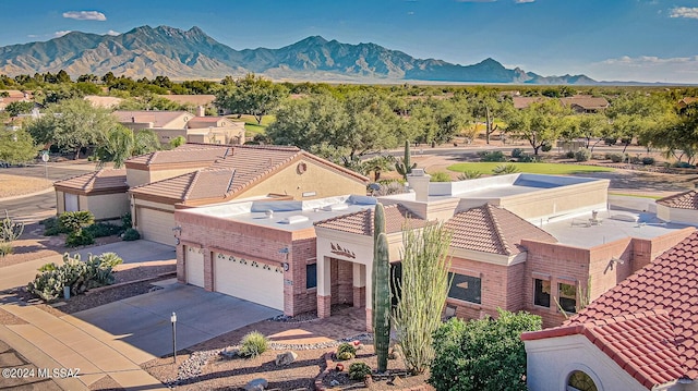 birds eye view of property featuring a mountain view