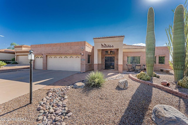 view of front of home with a garage