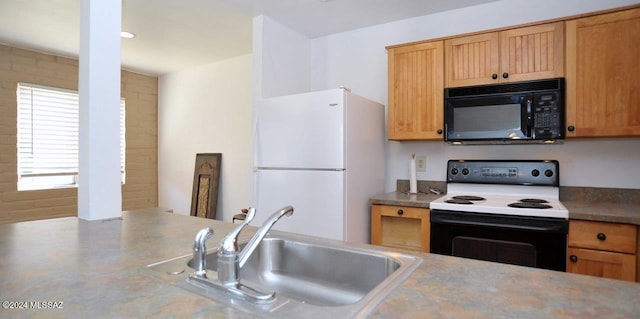 kitchen featuring white appliances and sink