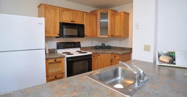 kitchen featuring sink and white appliances