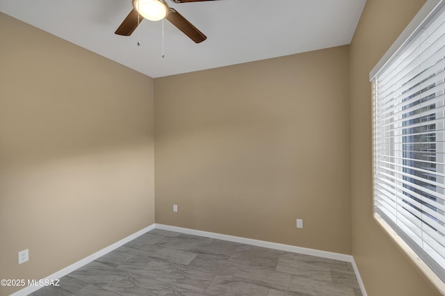 empty room featuring ceiling fan