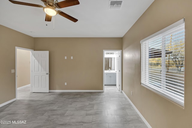 spare room with ceiling fan