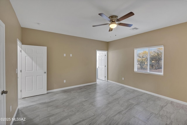 empty room featuring ceiling fan