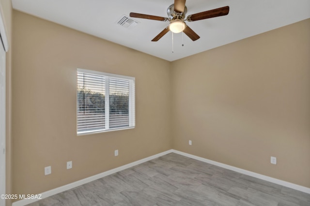 empty room featuring ceiling fan