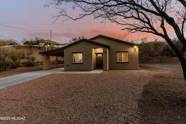 view of front of property with a carport